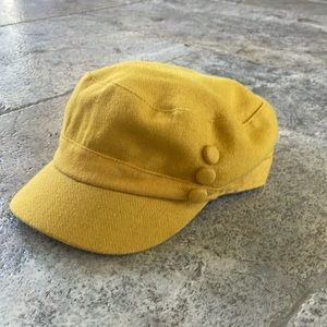 100% Wool! Mustard yellow winter cap with three covered buttons.